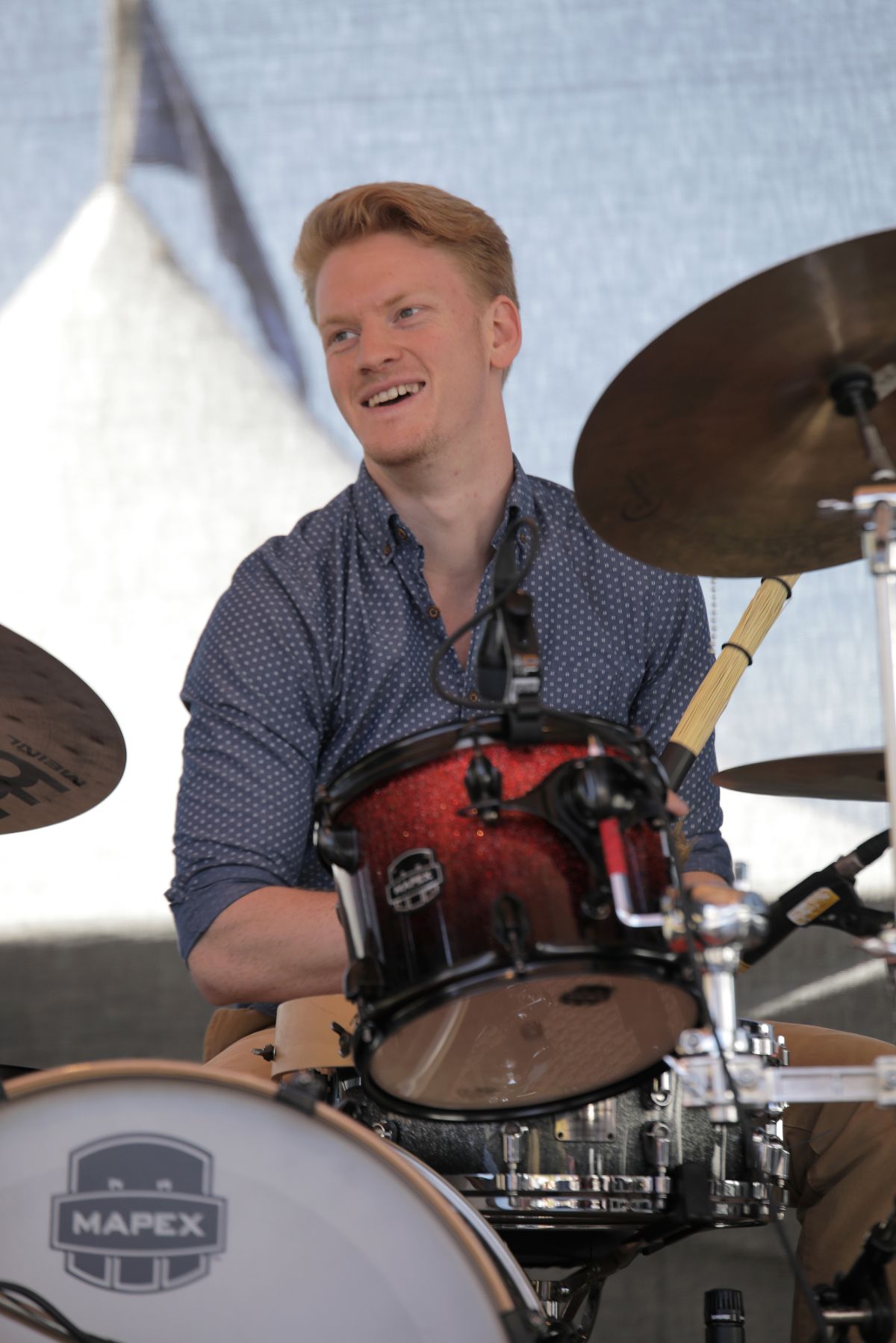 Alex Campbell playing an outdoor set in daylight