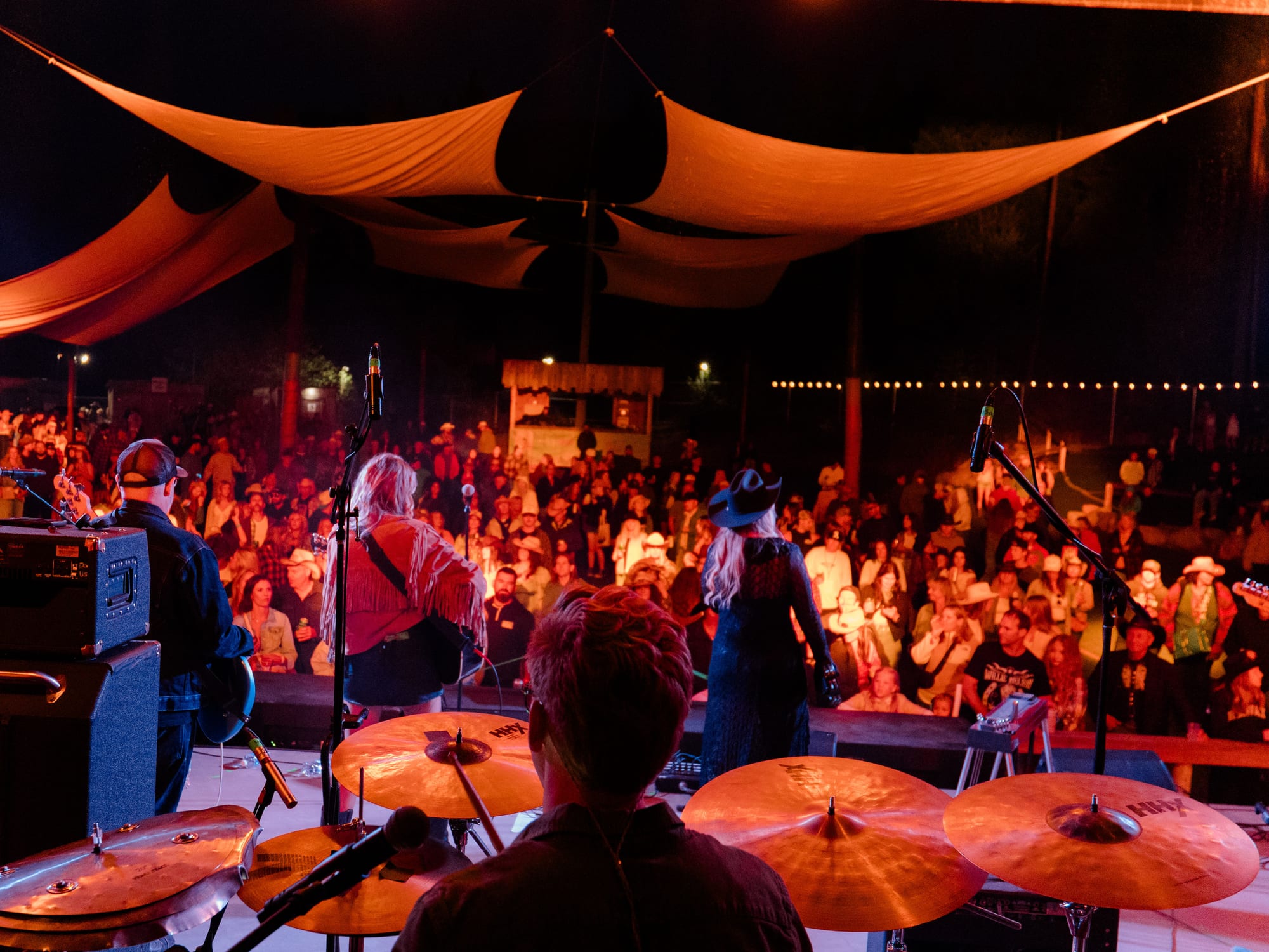 A full tent on a summer night